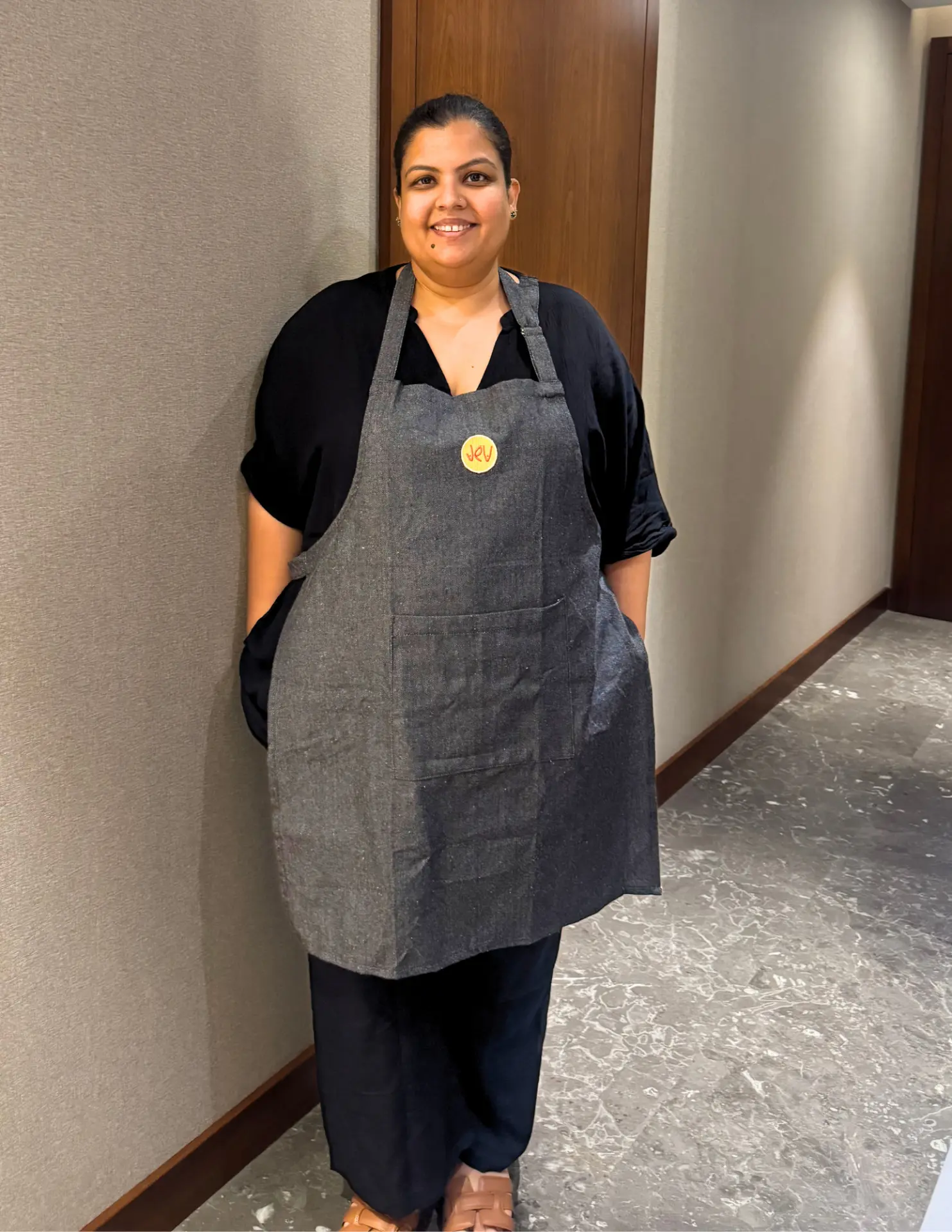 Arati Naik, founder of Jev, in her Jev apron