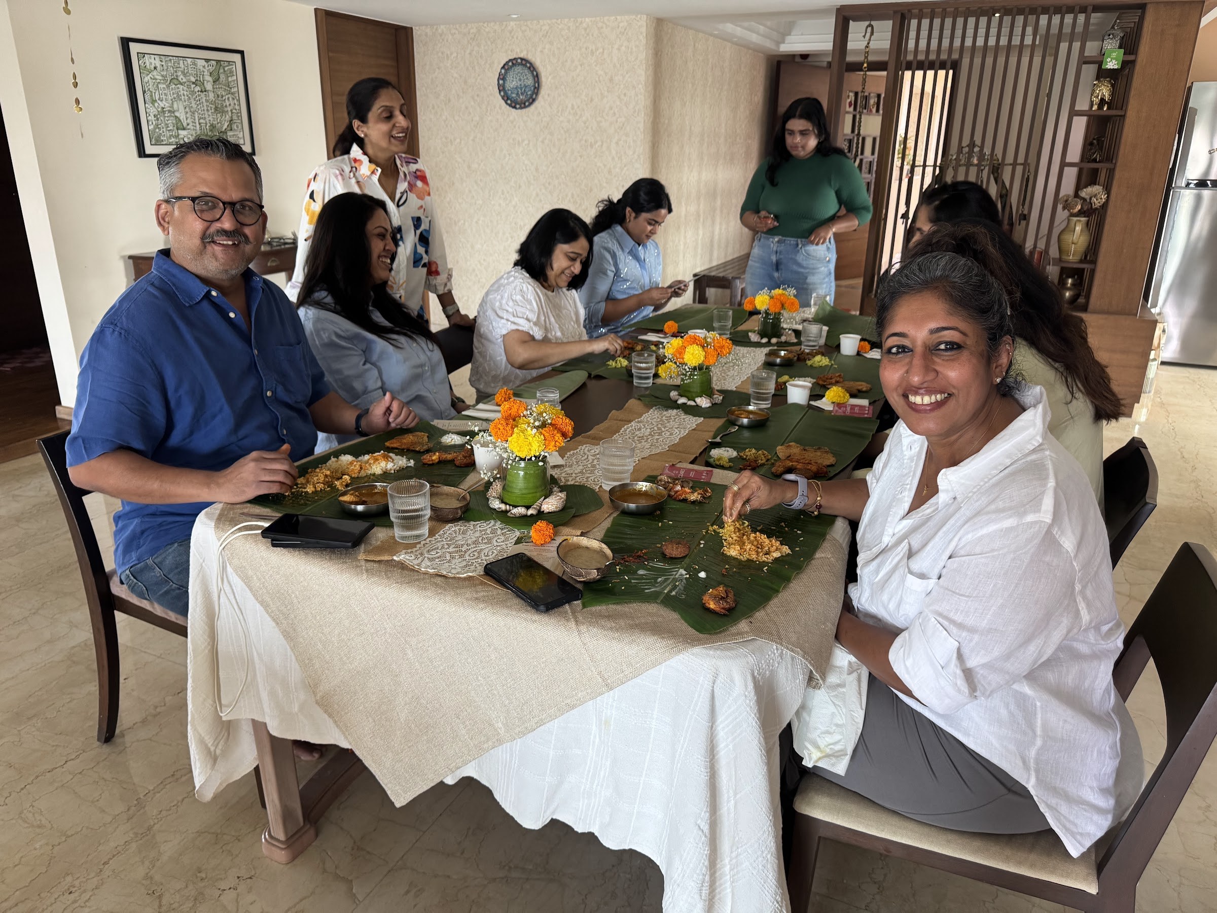 Guests gathered around Jev’s supper club table